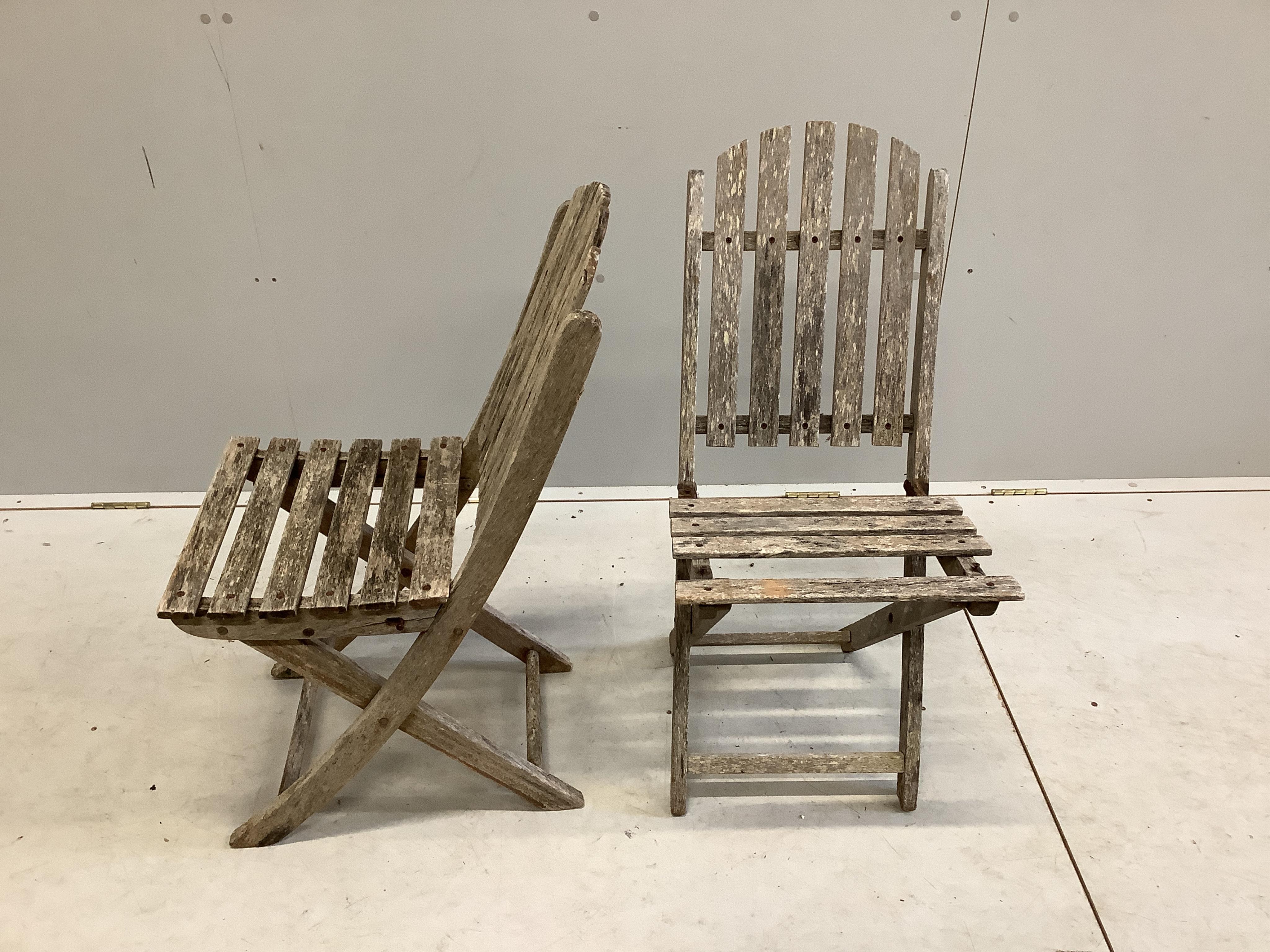 Two slatted wood folding garden tables and four chairs. Condition - very poor